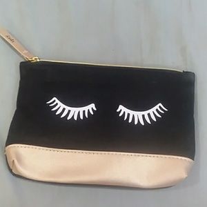 cute "rules were made to be broken" eyelash clutch